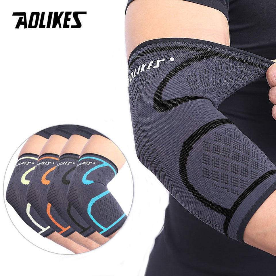 Grey knitted elbow compression sleeve worn on the arm